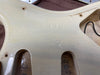 Close-up of vintage guitar body cavity showing embossed "RELIC" text and aged off-white finish with wood grain and wiring channels at Coffee House Guitars