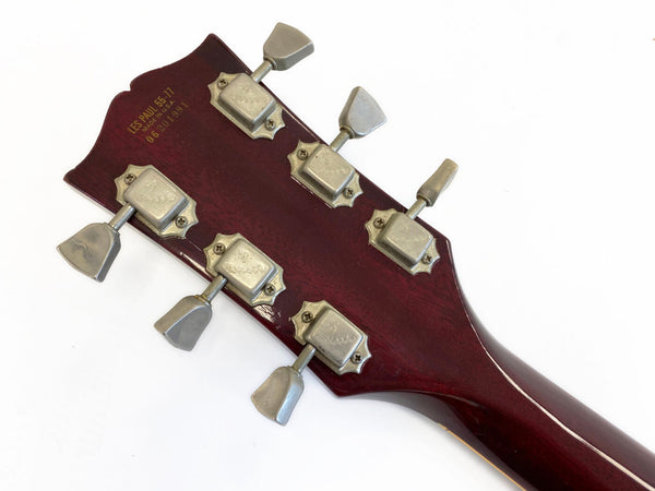 Back of Gibson Les Paul 55-77 guitar headstock with vintage tuning pegs and serial number on dark wood finish