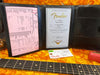 Fender Certificate of Authenticity and detailed specs sheet for 61 Stratocaster Relic guitar on orange plush case lining with guitar neck and red guitar body visible.