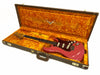 Fender Stratocaster electric guitar in pink finish with tortoiseshell pickguard in open vintage-style hard case with bright orange plush interior lining