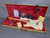 Fender Stratocaster electric guitar with vintage white finish, maple neck, and aged pickguard in tweed hard case with red plush interior, including certificate of authenticity, Fender custom care booklet, tremolo arm, maintenance tools, and original paperwork.
