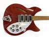 Vintage red semi-hollow electric guitar with three pickups, white pickguard, and multiple control knobs on a natural wood neck.