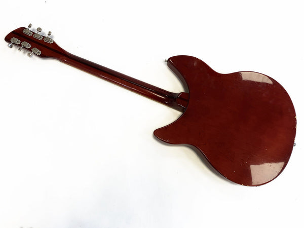 Back view of vintage red electric guitar with glossy finish and six tuning pegs on headstock isolated on white background