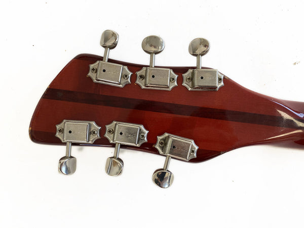 Back of guitar headstock with six vintage-style Grover tuning pegs on reddish-brown wood with darker wood center stripe, white background