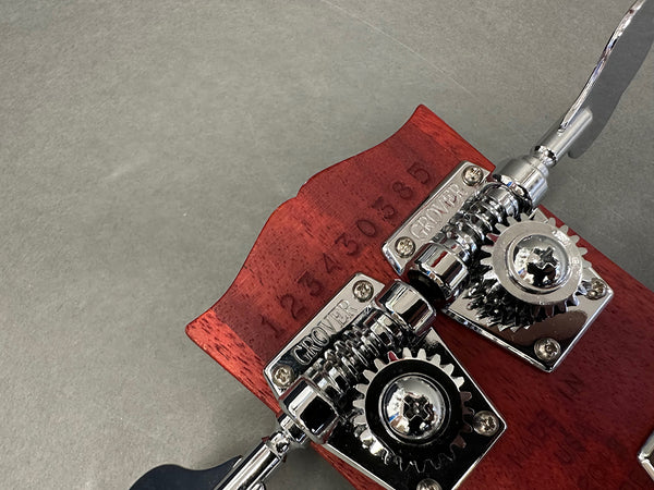 Close-up of vintage Grover guitar tuning pegs on red wood headstock with serial number 1234303585 visible, Coffee House Guitars product detail