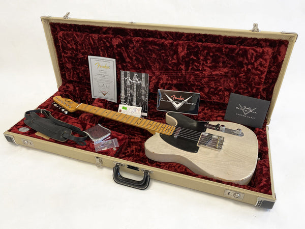 Fender Custom Shop Telecaster electric guitar in vintage white finish with maple neck, displayed in open hard case with red plush interior, includes certificate of authenticity, strap, and care booklet.