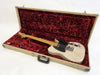 Vintage white Fender Telecaster electric guitar with black pickguard in beige hardshell guitar case lined with red plush interior