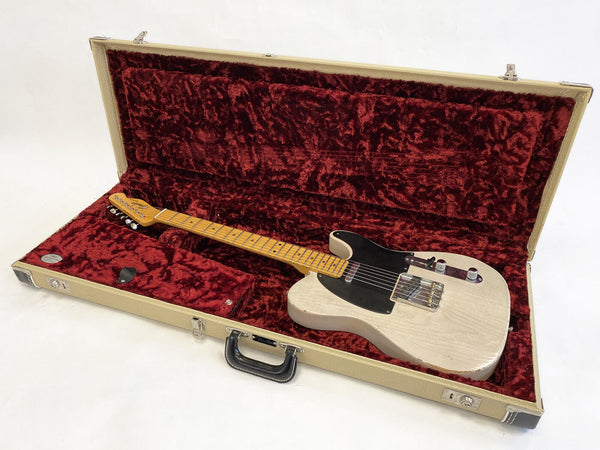 Vintage white Fender Telecaster electric guitar with black pickguard in beige hardshell guitar case lined with red plush interior