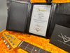 Fender '59 Telecaster Relic certificate of authenticity in black leather folder inside orange guitar case with Fender Telecaster headstock and rosewood fretboard