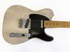Vintage cream electric guitar with black pickguard and maple fretboard showing worn finish and checking patterns on body