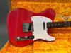 Vintage red Fender Telecaster electric guitar with white pickguard in orange plush Fender Custom Shop case