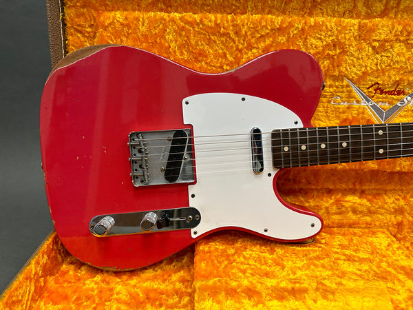 Vintage red Fender Telecaster electric guitar with white pickguard in orange plush Fender Custom Shop case