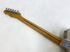 Vintage Fender guitar neck with six tuning pegs, maple wood with dark skunk stripe, signed headstock, and metal neck plate on white background.