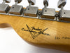 Close-up of Fender Custom Shop Pro Model vintage style tuning machines on maple guitar headstock with Fender Custom Shop logo
