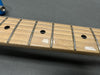 Close-up image of maple guitar neck and fretboard with dot inlays and metal frets on electric guitar from Coffee House Guitars