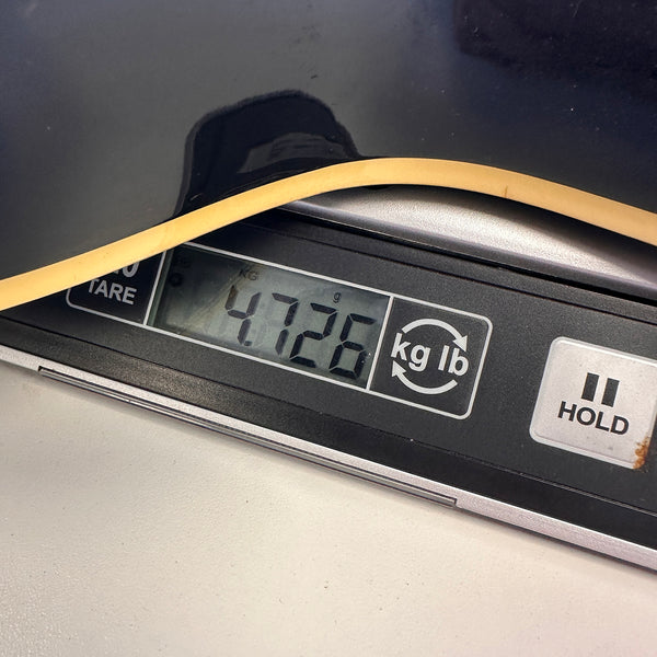 Close-up of digital scale showing guitar weight of 4.726 kilograms with part of guitar body visible, Coffee House Guitars product image.