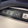Digital scale display showing 8 pounds 1.2 ounces weight with tare and hold buttons, close-up view.
