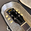 Close-up of Greco guitar headstock with vintage yellow tuning pegs inside plush lined hardshell guitar case at Coffee House Guitars product listing