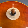 Close-up of vintage guitar pickup selector switch on sunburst electric guitar body with "RHYTHM" and "TREBLE" labeled selector ring