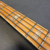 Close-up of maple guitar fretboard with pearl block inlays and metal frets on Coffee House Guitars electric bass guitar