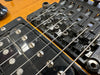 Close-up of electric guitar Floyd Rose locking tremolo bridge and black humbucker pickup on honey burst finish guitar body