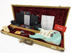 Fender Custom Shop vintage style electric guitar in aged seafoam green finish with maple neck, displayed in tweed hardshell case with red velvet interior, including Fender Certificate of Authenticity, owner’s manual, strap, tremolo arm, key, and other official Fender documentation.