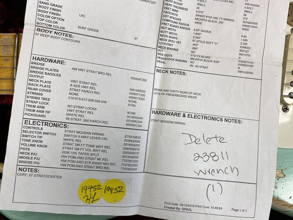 Close-up of detailed 57 Stratocaster guitar specification sheet showing body notes, hardware, electronics, neck notes, and wiring information for Coffee House Guitars product listing.