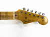 Close-up of vintage Fender Stratocaster guitar headstock with tuning pegs and worn maple neck showing "Original Contour Body" decal on white background