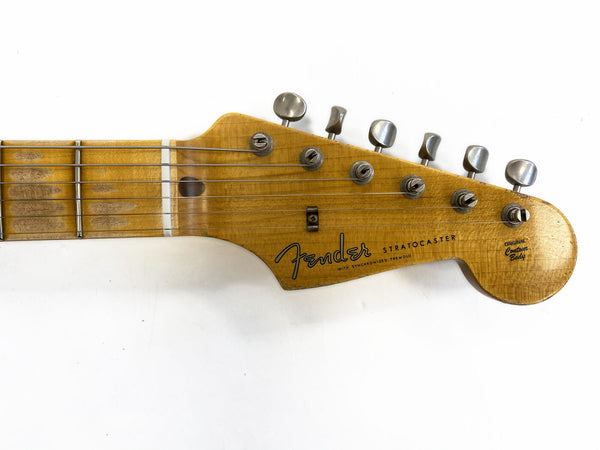 Close-up of vintage Fender Stratocaster guitar headstock with tuning pegs and worn maple neck showing "Original Contour Body" decal on white background