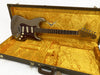 Fender Stratocaster electric guitar in metallic grey with tortoiseshell pickguard inside vintage yellow plush-lined Fender custom shop hard case