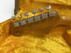 Fender Custom Shop Limited Edition guitar headstock with vintage tuning pegs inside yellow plush lined guitar case