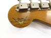 Close-up of Fender Custom Shop Limited Edition logo on natural wood guitar headstock with vintage tuning pegs
