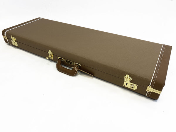 Brown rectangular hard guitar case with gold latches and handle on white background, Fender guitar case for electric guitars