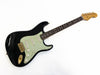 Black Fender Stratocaster electric guitar with mint green pickguard and rosewood fingerboard, vintage style single-coil pickups and maple neck