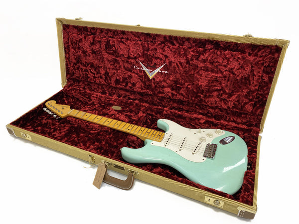 Fender Custom Shop electric guitar with seafoam green finish and maple neck in vintage tweed hard case with red velvet interior lining