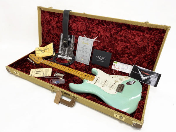 Fender Custom Shop seafoam green electric guitar with maple neck and white pickguard in tweed hard case with red plush interior, including owner's manual, certificate of authenticity, strap, Fender Custom Care booklet, and accessories