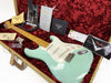 Fender Custom Shop Surf Green Stratocaster electric guitar with maple neck in open tweed hardshell case with certificate of authenticity, owner's manual, strap, tremolo arm, and Fender Custom Care booklet on red plush interior