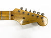 Vintage Fender Stratocaster guitar headstock with original tuning pegs and logo on maple wood neck