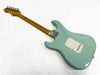 Vintage light blue electric guitar with bolt-on maple neck and vintage-style tuning pegs, viewed from the back on a white background.