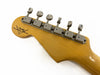 Vintage Fender Custom Shop guitar headstock with six vintage-style tuning pegs and Fender Custom Shop logo on natural wood finish