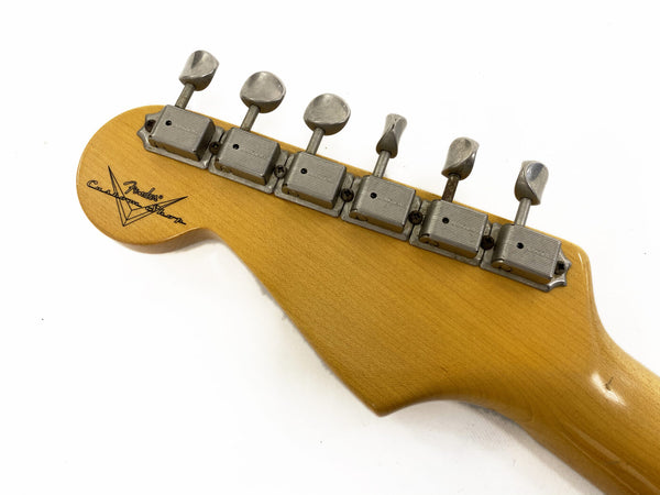 Vintage Fender Custom Shop guitar headstock with six vintage-style tuning pegs and Fender Custom Shop logo on natural wood finish