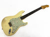 Vintage Fender Stratocaster electric guitar in aged white finish with mint green pickguard and rosewood fretboard, showing natural wear and relic markings