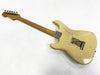 Vintage cream electric guitar body with maple neck and metal tuning pegs, back view showing wear and scratches, missing strings and rear tremolo springs exposed