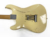 Vintage cream electric guitar body with visible wear and tremolo springs, maple neck, metal neck plate with serial number, shown from back side on white background