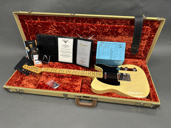Fender Telecaster guitar in vintage blonde finish with black pickguard in tweed hard case with orange plush interior, including Fender certificate of authenticity, shop floor traveler, warranty card, and accessories