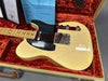 Vintage cream Fender Telecaster electric guitar with maple neck and black pickguard in orange plush lined tweed hard case with certificate of authenticity and setup sheet