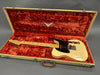 Vintage Fender Telecaster electric guitar with maple neck and black pickguard in tweed case with red plush interior lining