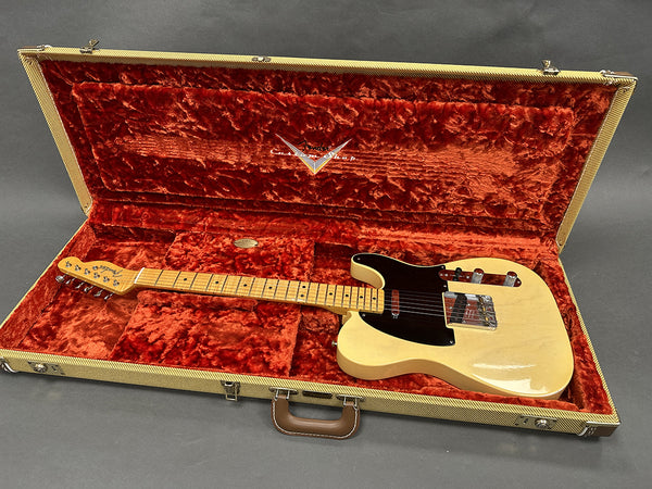 Vintage Fender Telecaster electric guitar with maple neck and black pickguard in tweed case with red plush interior lining