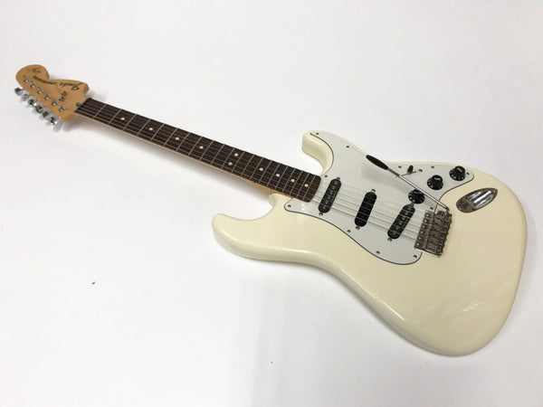 Fender Stratocaster electric guitar in vintage white with rosewood fretboard and three single-coil pickups on white background