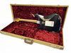 Vintage worn black electric guitar back view with maple neck inside tan tweed hard shell case lined with red plush interior for Fender Stratocaster model
